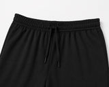 mávros black cotton-blend terry sweatpants featuring a clean elastic waistband with matching drawstring