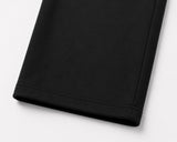 Close-up of the hem of black mávros sweatpants made from soft 260 GSM cotton-polyester terry fabric.
